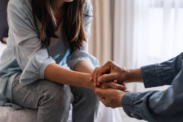 Therapist offering compassionate support during an individual trauma therapy session